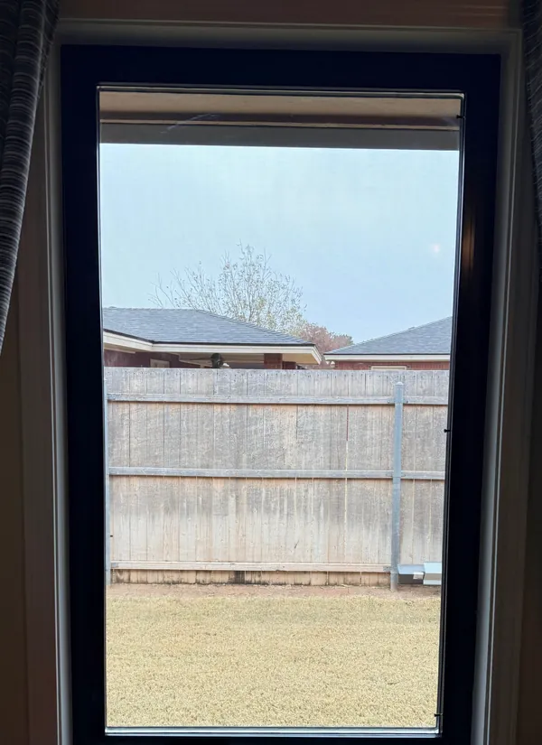 A new black-framed window seen from inside.